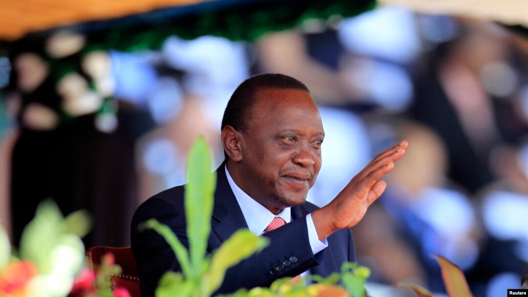 Kenya's President Uhuru Kenyatta reacts as he attends Mashujaa (Heroes) Day at the Nyayo National Stadium in capital Nairobi, Oct. 20, 2013.