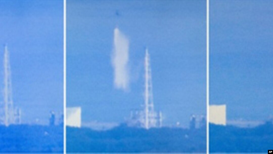 Screen grabs from Japanese national broadcaster NHK show a Japanese military cargo helicopter dumping water onto reactor number 3 at the stricken Fukushima nuclear power plant on March 17, 2011