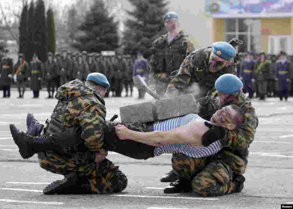 Russian paratroopers perform during a military show in the southern city of Stavropol.