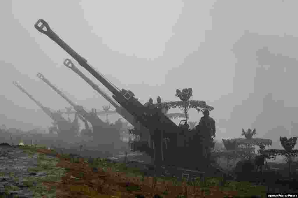 Indian Army soldiers stand next to Bofors guns positioned at Penga Teng Tso ahead of Tawang, near the Line of Actual Control (LAC), neighbouring China, in India's Arunachal Pradesh state.
