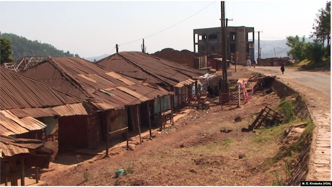 FILE - Clothes hang on a clothes line in front of a row of largely abandoned homes, in Kumbo, Cameroon, Jan. 3, 2019.