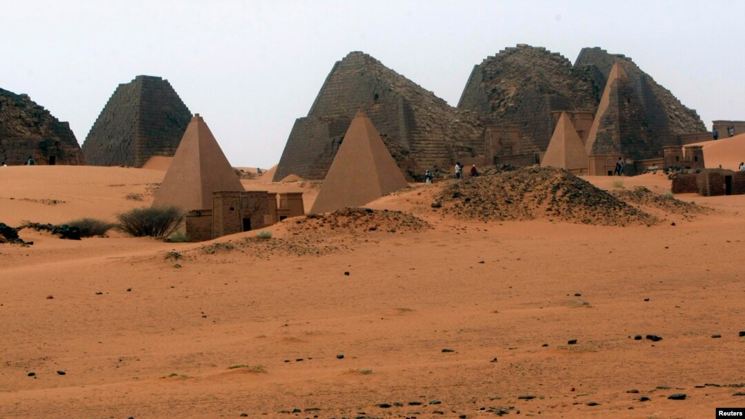 Tourists explore 44 Nubian pyramids of kings and queens in the ruins of the ancient city of Meroe next to Begrawiya, in the River Nile state of Sudan, March, 10, 2012. 