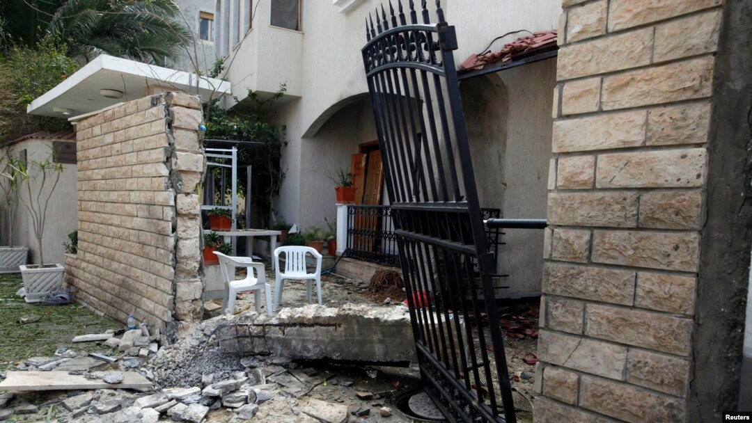A general view of the damage caused by a bomb blast is seen at the gate of the Iranian ambassador's residence in Tripoli, Libya, Feb. 22, 2015.