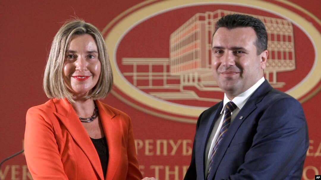 FILE - European Union High Representative for Foreign Affairs and Security Policy Federica Mogherini, left, and Macedonian Prime Minister Zoran Zaev pose for a photo, following their meeting at the government building in Skopje, Macedonia, April 18, 2018. 