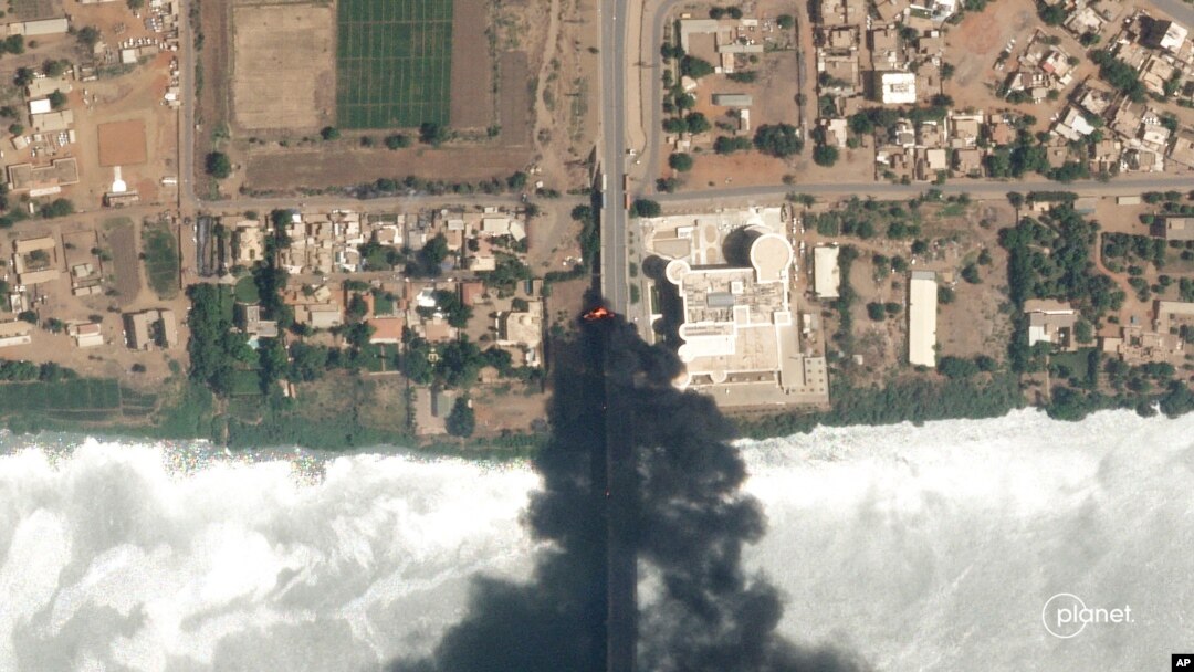 This satellite photo by Planet Labs PBC shows fires burning near a hospital in Khartoum, Sudan, April 16, 2023.