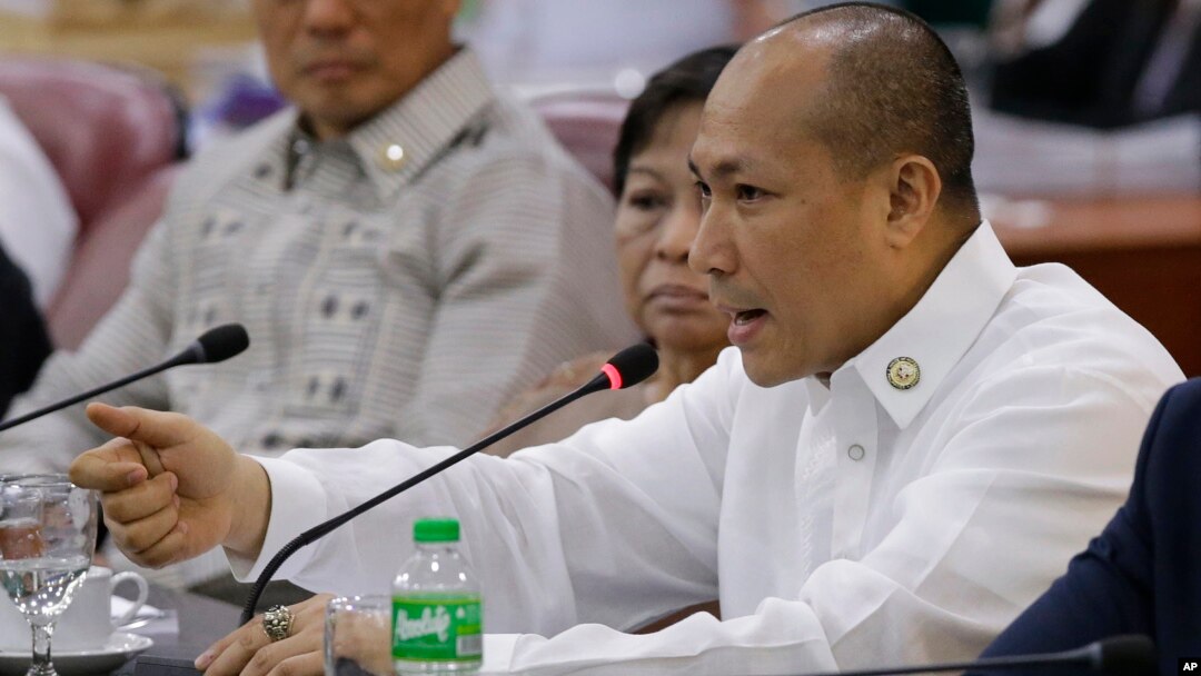 FILE - Rep. Gary Alejano gestures as he tries to defend the impeachment complaint he filed against Philippine President Rodrigo Duterte during a Justice Committee hearing at the House of Representatives in metropolitan Manila, Philippines, May 15, 2017.