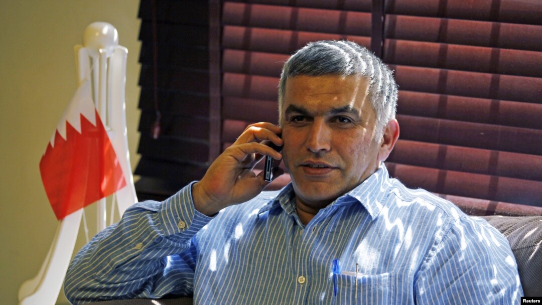 FILE - Bahrain human rights activist Nabeel Rajab is seen talking on his mobile phone.