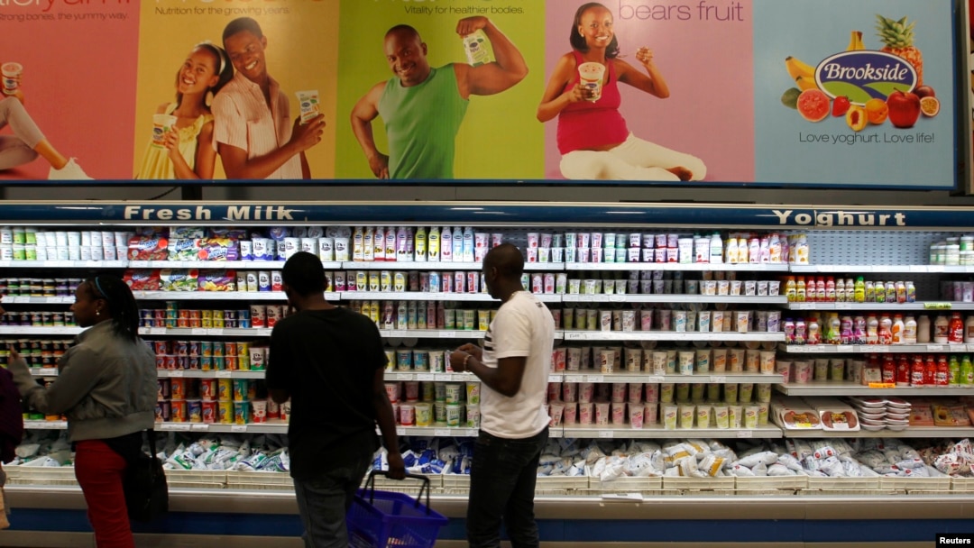 FILE - Shoppers are seen in the dairy section of a supermarket in Kenya's capital Nairobi, July 18, 2014.