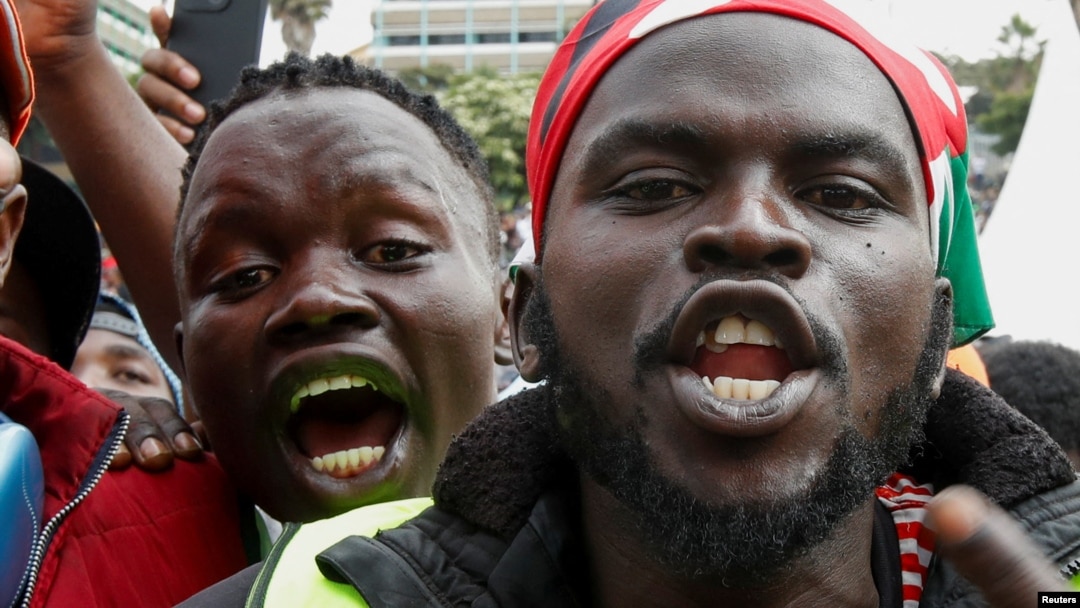 People react during a concert in memory of people who were killed during a demonstration against the imposition of tax hikes, in Nairobi, Kenya, July 7, 2024. The deadly protests led President William Ruto to reject the increases.