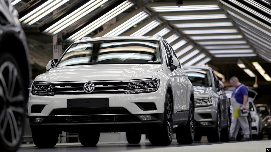 FILE - Volkswagen cars are pictured as they undergo a final quality control at the Volkswagen plant in Wolfsburg, Germany, March 8, 2018.