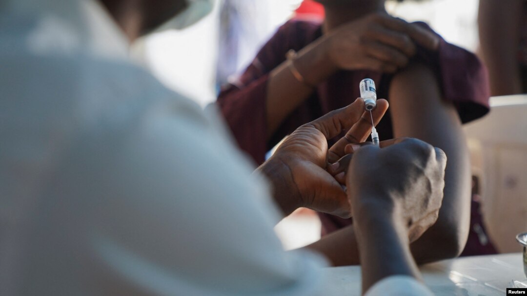 A Nigerian health official prepares to administer an mpox vaccination at Federal Medical Center in Abuja, Nigeria, Nov. 18, 2024. 