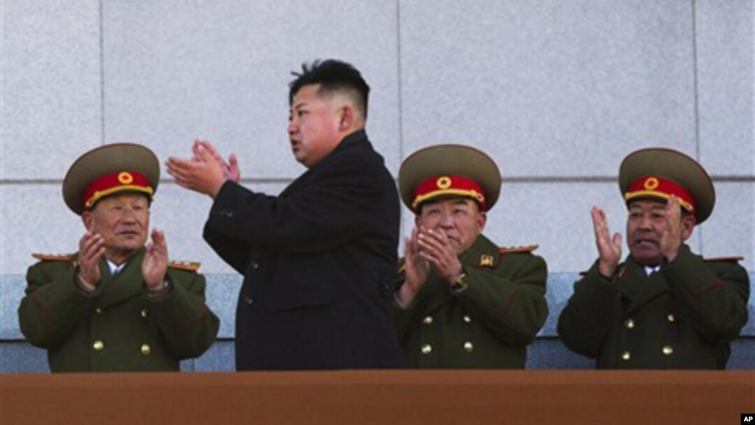 New North Korean leader Kim Jong Un, second from left, applauds as he leaves the stands at Kumsusan Memorial Palace in Pyongyang, Feb. 16, 2012.