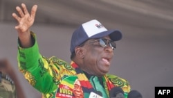 FILE: President of Zimbabwe Emmerson Mnangagwa gestures during a Zimbabwe African National Union – Patriotic Front (ZANU-PF) election campaign rally in Shurugwi on August 19, 2023.