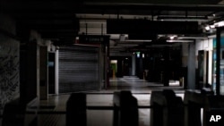 Hallways of Buenos Aires' subway are lit only by emergency lights during a blackout, in Buenos Aires, Argentina, June 16, 2019. 