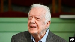 FILE - In this Nov. 3, 2019, photo, former President Jimmy Carter teaches Sunday school at Maranatha Baptist Church in Plains, Ga.