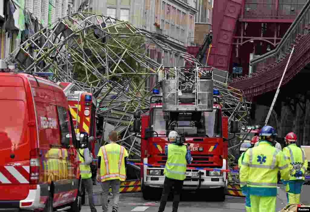 Rescue personnel is seen at the scene of a scaffolding collapse in Antwerp, Belgium.