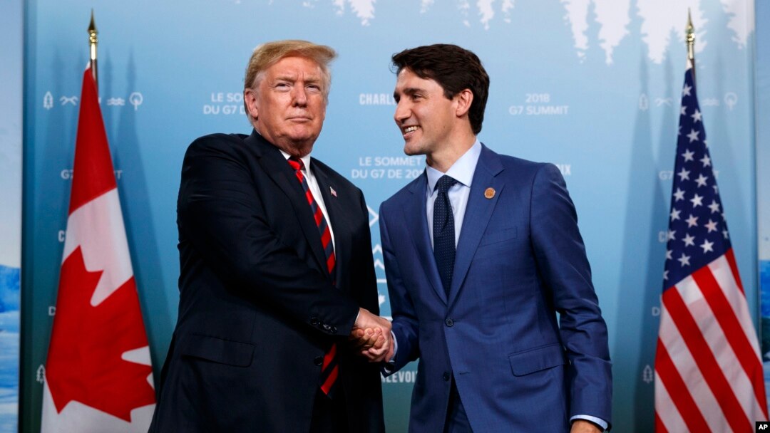 FILE - President Donald Trump, left, meets with Canadian Prime Minister Justin Trudeau during the G-7 summit, June 8, 2018, in Charlevoix, Canada.