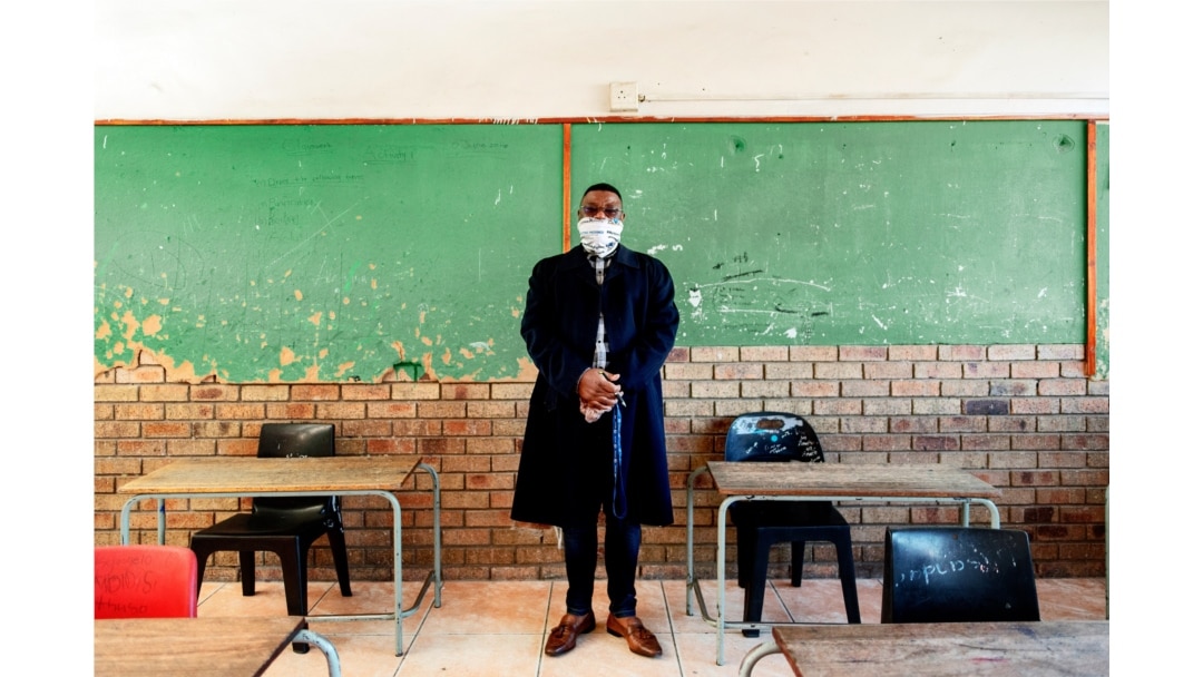 Mr. Gwala, headmaster of the Ithute Higher Primary School, poses for a portrait in an empty classroom in Alexandra, Johannesburg, on June 1, 2020.