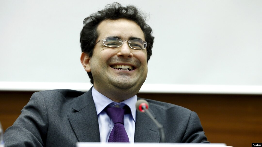 FILE - Executive director of UN Watch Hillel Neuer smiles after the presentation of a report by the Independent Commission of Inquiry on the 2014 Gaza Conflict in Geneva, June 29, 2015.