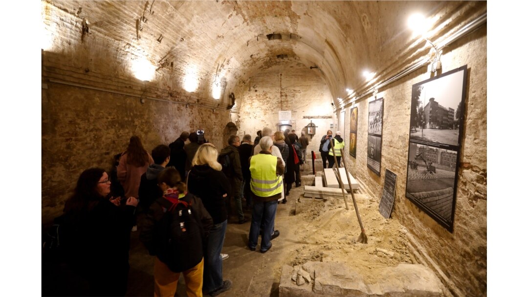 People line up to see an escape tunnel underneath the Berlin Wall that divided the city for 28 years during the Cold War, and was made visible for public for the first time, in Berlin, Germany, Nov. 7, 2019.