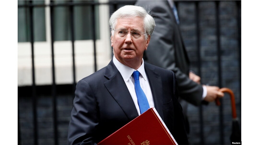 FILE - Britain's Minister of Defense Michael Fallon leaves 10 Downing Street after a cabinet meeting, in London, Britain, June 27, 2017.