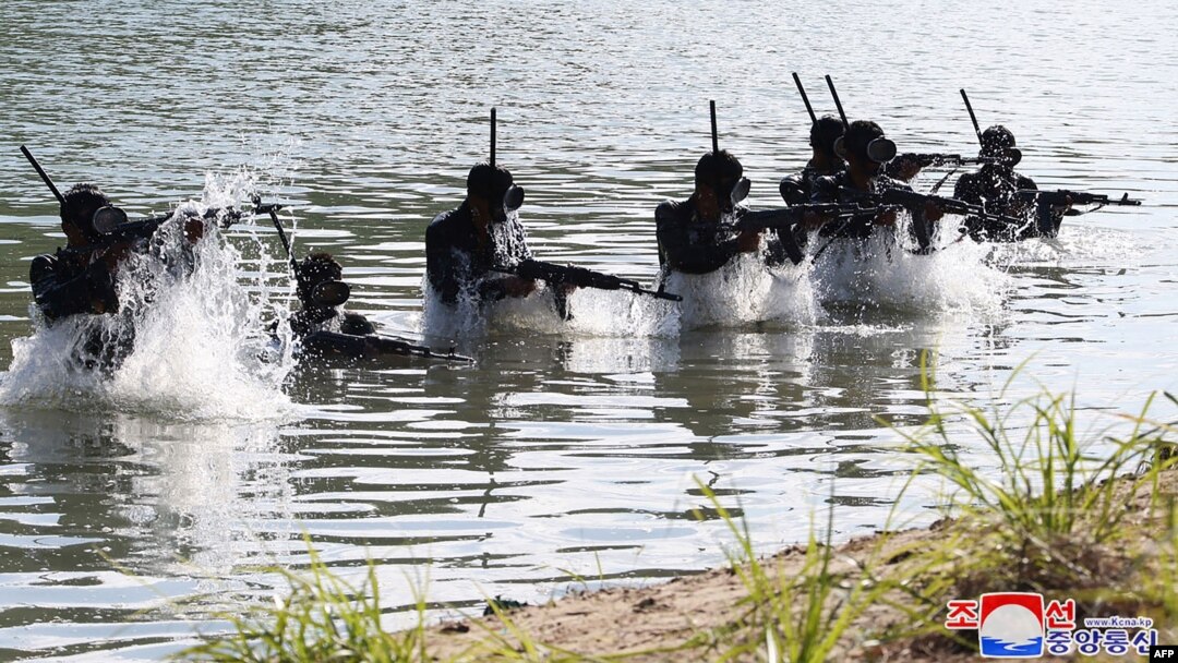 FILE - Troops take part in training at a base of the Korean People's Army's special operations forces, at an undisclosed location in North Korea, in this picture taken Oct. 2, 2024, and released from the Korean Central News Agency via KNS on Oct. 4, 2024 