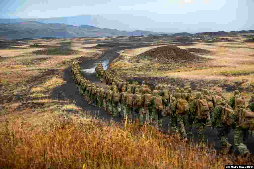 U.S. Marines with the 24th Marine Expeditionary Unit hike to a cold-weather training site during Exercise Trident in Iceland, Oct. 19, 2018.