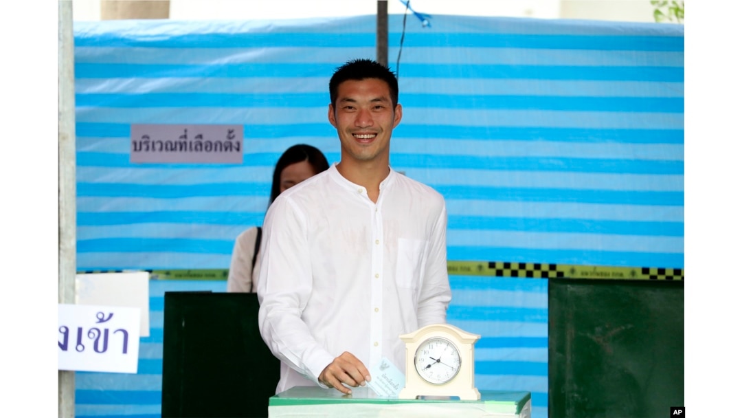 FILE - Thanathorn Juangroongruangkit, leader of Future Forward Party, poses as he casts his vote during general election at a polling station in Bangkok, March 24, 2019.