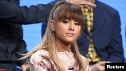 FILE - Ariana Grande answers questions during the panel for "Hairspray Live!" at the NBC Universal Television Critics Association press tour in Beverly Hills, California.