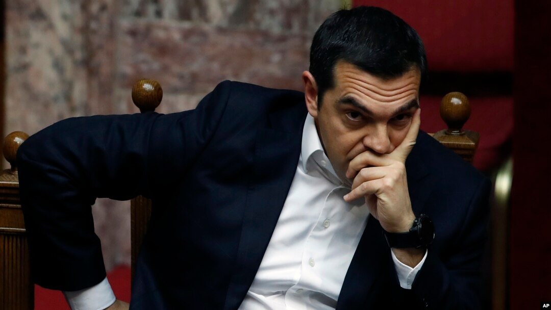 Greece's Prime Minister Alexis Tsipras joins a parliament session in Athens, Feb. 8, 2019. Greek lawmakers became the first to ratify Macedonia's NATO accession.