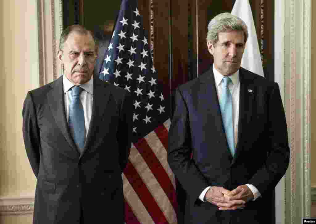 U.S. Secretary of State John Kerry (R) and Russia's Foreign Minister Sergei Lavrov are seen before their meeting at Winfield House, the home of the U.S. ambassador in London.