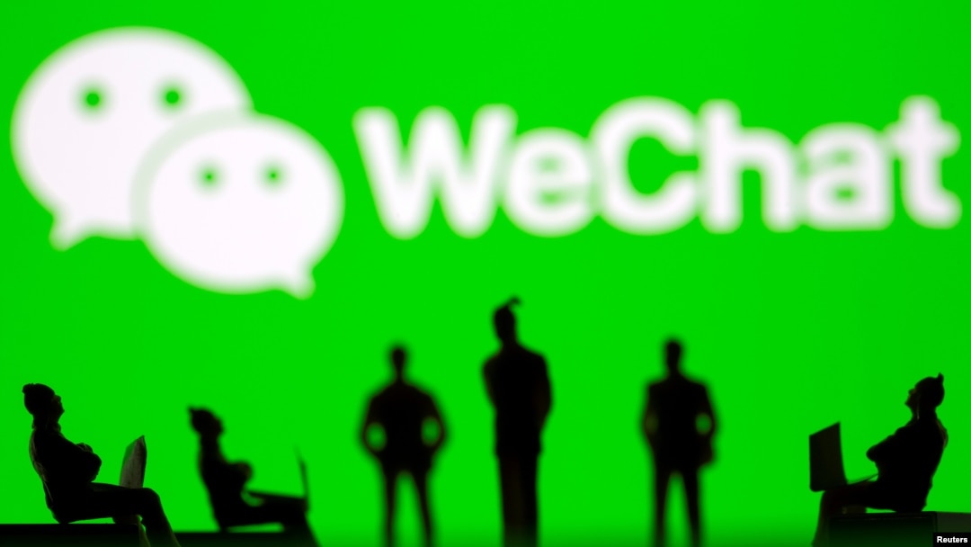 FILE - Small toy figures are seen in front of WeChat logo in this illustration picture taken March 15, 2021. (REUTERS/Dado Ruvic/Illustration)