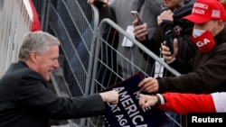 FILE - White House Chief of Staff Mark Meadows greets supporters of President Donald Trump during a campaign rally at Reading Regional Airport in Reading Penn., Oct. 31, 2020.