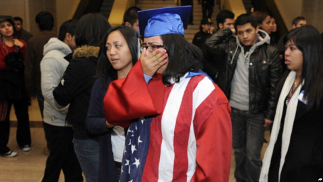 Students, some wearing graduation caps and gowns, cry after watching from the senate gallery as opponents block passage of the "Dream Act" at the U.S. Capitol in Washington, D.C., 18 Dec 2010