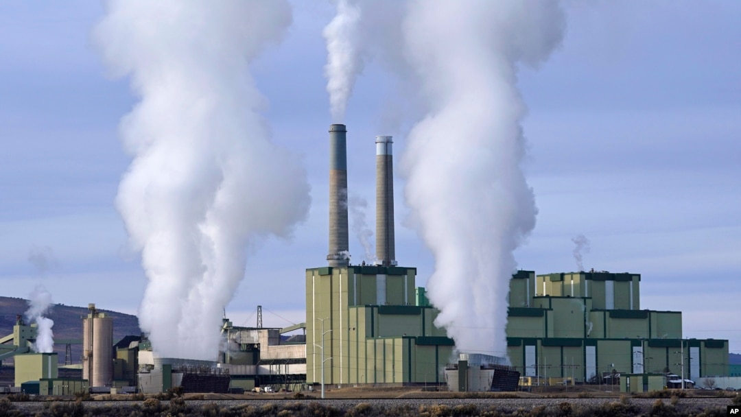 FILE - Steam billows from a coal-fired power plant Nov. 18, 2021, in Craig, Colorado.