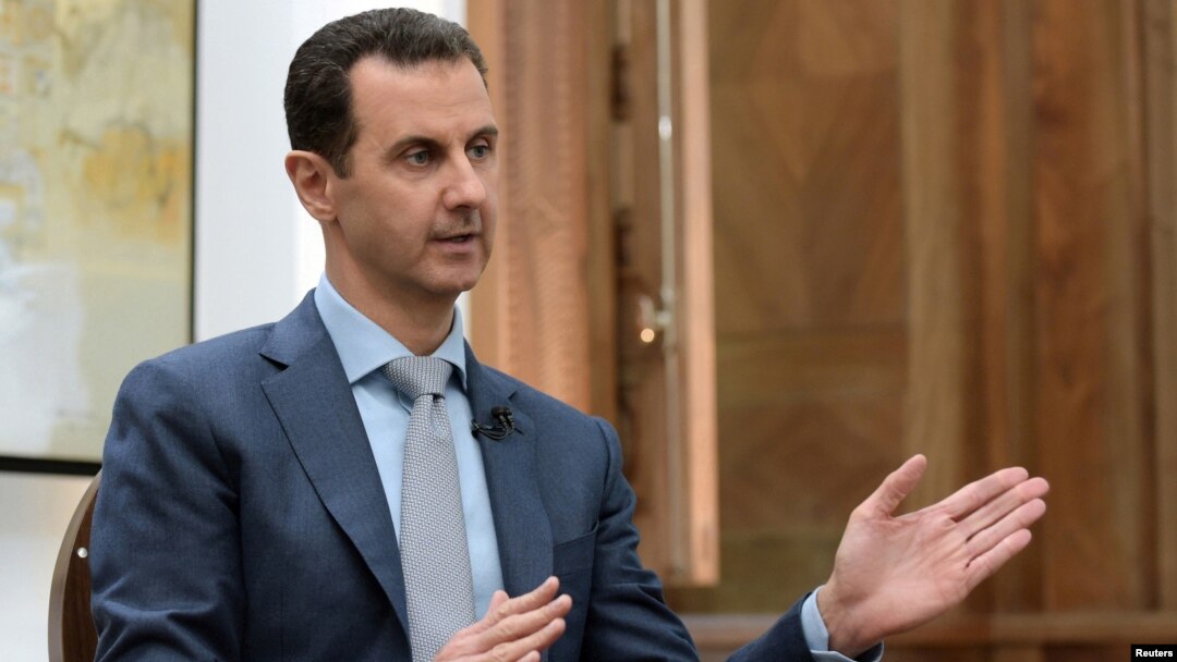 Syria's President Bashar al-Assad is interviewed Feb. 10, 2017, in Syria. Thousands of Afghans from Iran are involved in the Syrian conflict, many sent against their will, Human Rights Watch reports.