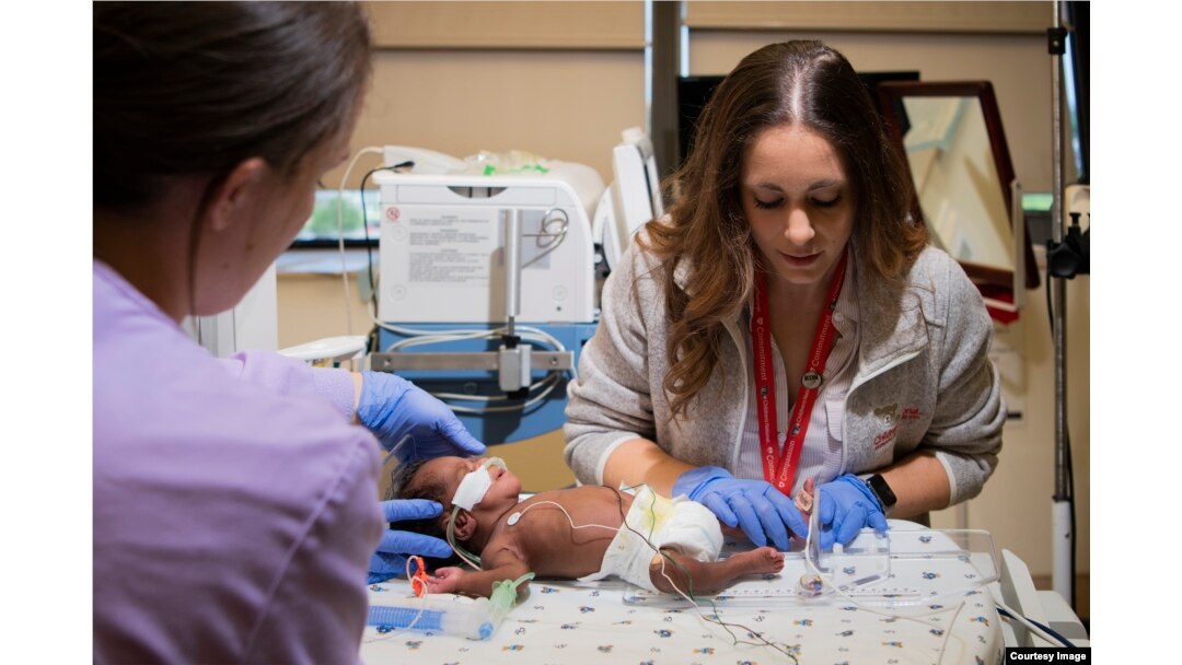 In this 2018 photo, nurses care for a micro preemie at Children's National NICU in Washington, D.C.