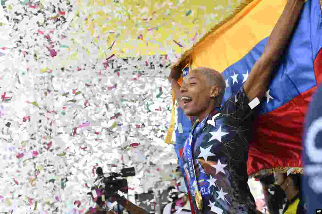 Yulimar Rojas, who won the Olympic gold medal in the women's triple jump at the 2020 Tokyo Olympic Games and set a new world record, is welcomed home upon return to Caracas, Venezuela.