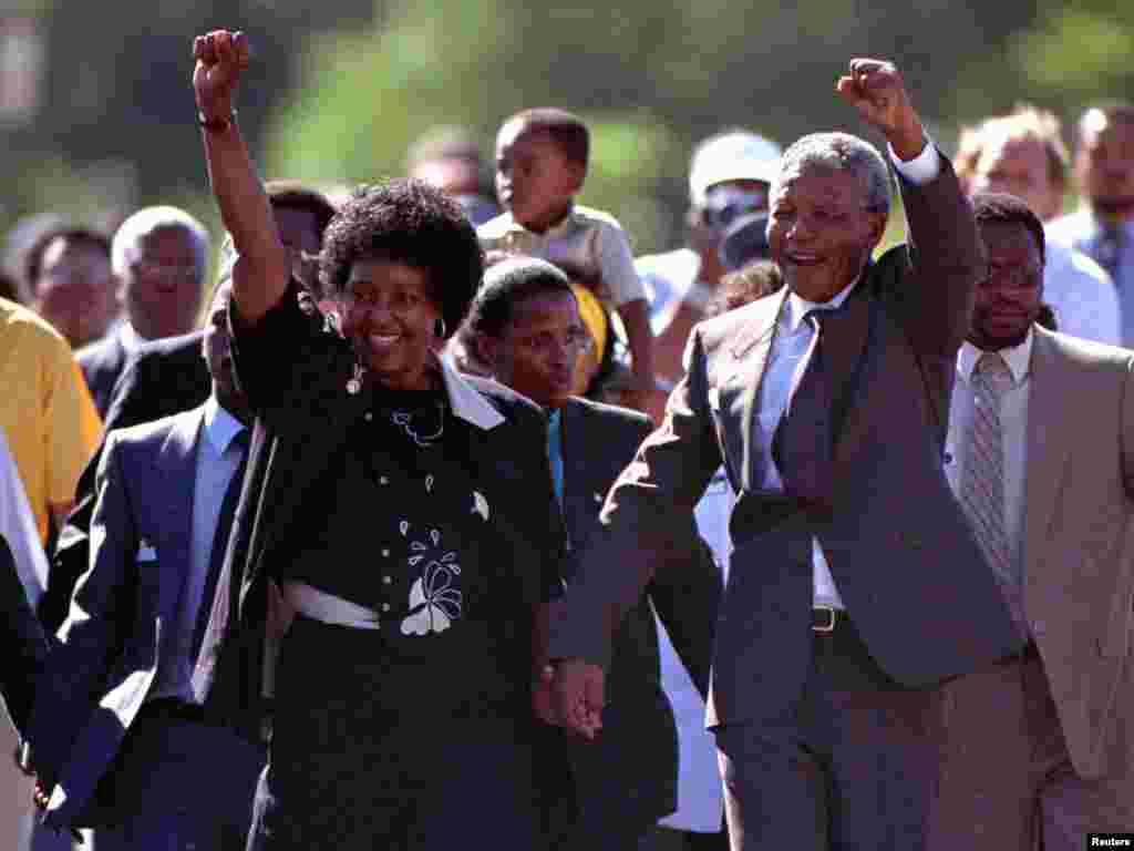 Nelson Mandela and his then wife, Winnie, salute well-wishers as he leaves Victor Verster prison on Feb. 11, 1990.