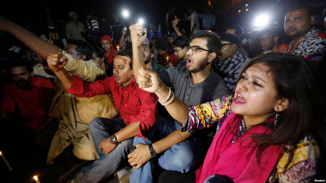 People chant slogans as they attend a sit-in protest at Shahbagh intersection demanding capital punishment for Bangladesh's Jamaat-e-Islami senior leader Abdul Quader Mollah after he won a dramatic stay of execution before he was due to be hanged in Dhaka