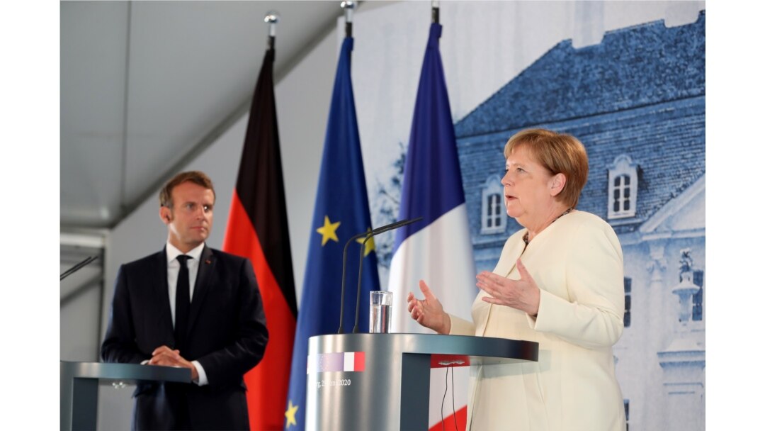 German Chancellor Angela Merkel and French President Emmanuel Macron give a joint press conference after a bilateral meeting at Meseberg Castle, in Meseberg, Germany, June 29, 2020.