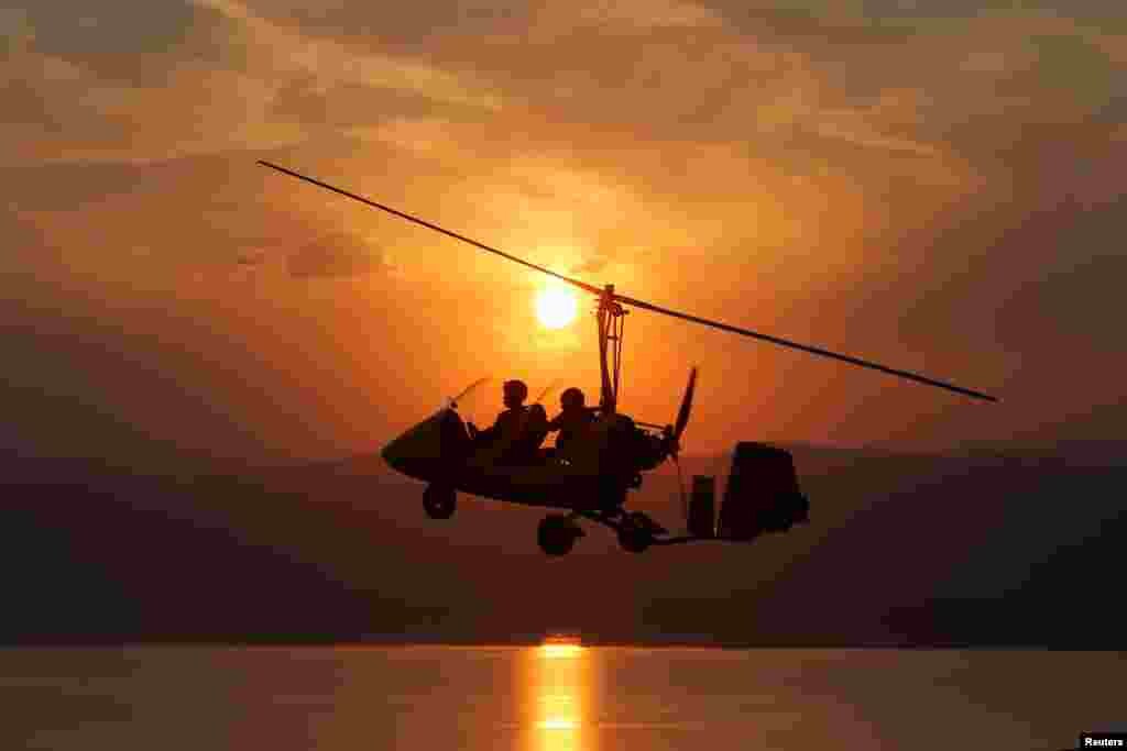 The Royal Aero Sports Club of Jordan plane known as a gyrocopter flies to provide tourists and visitors with a bird's eye view of the Dead Sea, Jordan, Nov. 13, 2018.