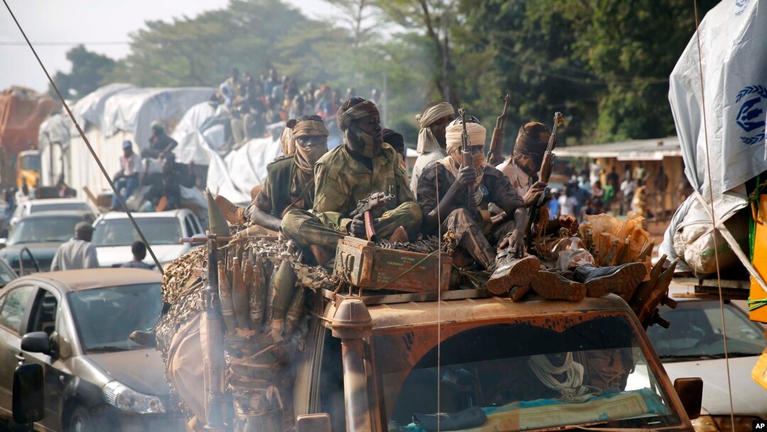 FILE - Chadian troops escort Muslim residents from Bangui and Mbaiki, Feb. 7, 2014.