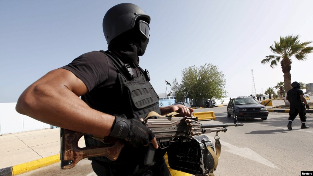 A member of the force assigned to protect Libya's unity government stands at the entrance to where the government has their offices, in Tripoli, Libya, April 14, 2016.