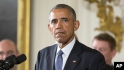 President Barack Obama pauses as he speaks in the East Room of the White House in Washington, Jan. 5, 2016, about steps his administration is taking to reduce gun violence. 