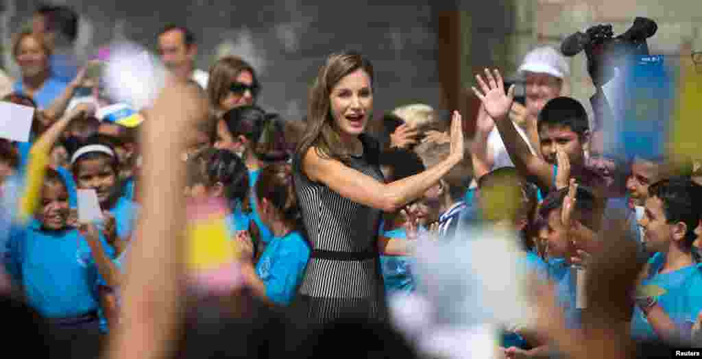 Spanish Queen Letizia is greeted by children at "San Matias" primary school during the inauguration of the school year in La Laguna.