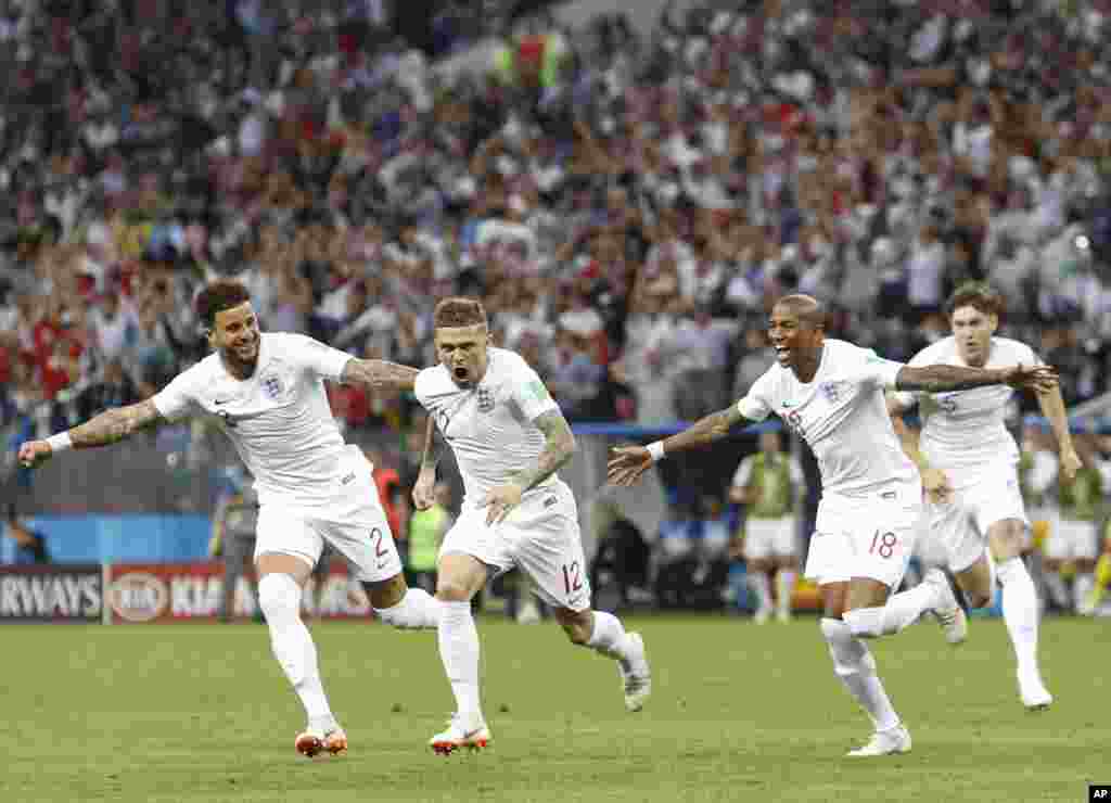 England's Kieran Trippier, second from left, celebrates after scoring the opening goal during the semifinal match between Croatia and England at the 2018 soccer World Cup in the Luzhniki Stadium in Moscow, Russia.
