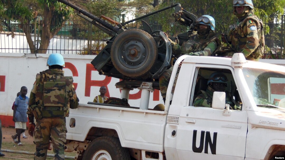 FILE - U.N. peacekeepers take a break as they patrol along a street during presidential elections in Bangui, the capital of the Central African Republic, Dec. 30, 2015. 