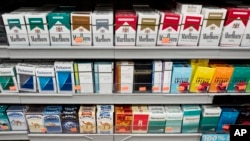 Cigarettes are displayed on a shelf in New York, Aug. 28, 2017.