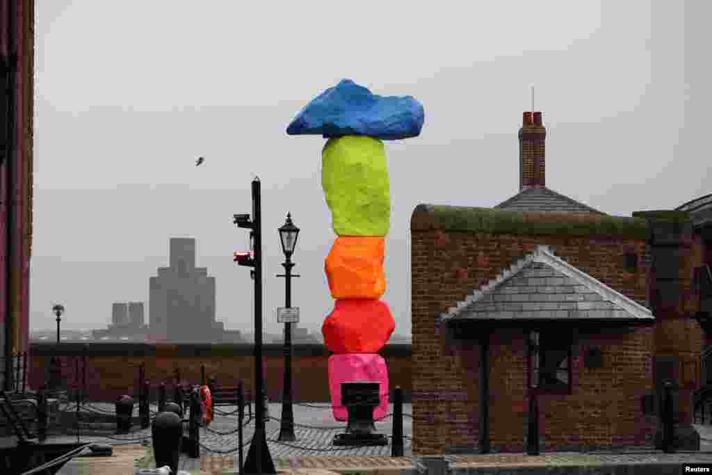 Ugo Rondinone's Liverpool Mountain stands outside the Tate in Liverpool, Britain.